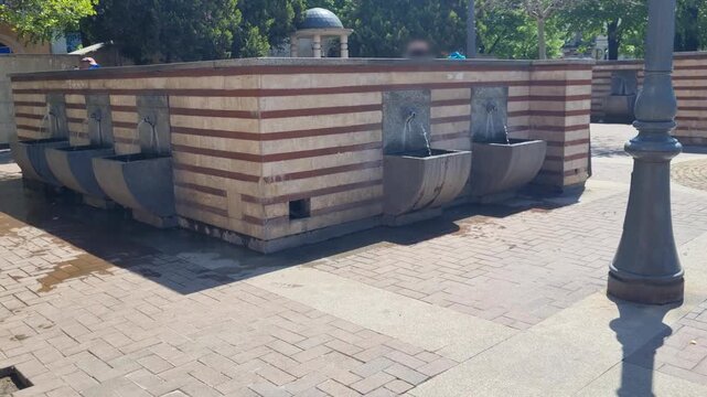 Shot of mineral water springs in Sofia&rsquo;s Serdika district, Bulgaria, where locals come to fill bottles for health benefits from natural healing fountains in the city center