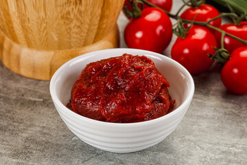 Red tomato paste in the bowl