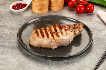 Grilled pork loin steak with bone
