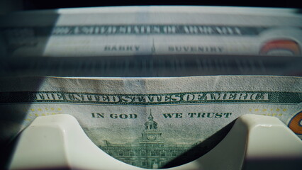 Closeup bank machine working with paper cash dollars inside modern office fast