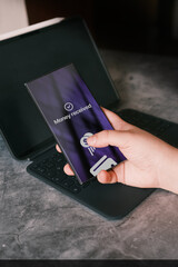 Smartphone screen displaying money transfer confirmation. Woman transfering money online using app...
