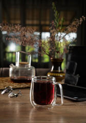 Enjoying a warm cup of tea in a cozy setting with natural light and beautiful decor