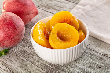 Sweet ripe yellow canned peaches