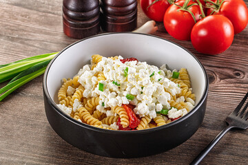 Italian pasta fusili with curd