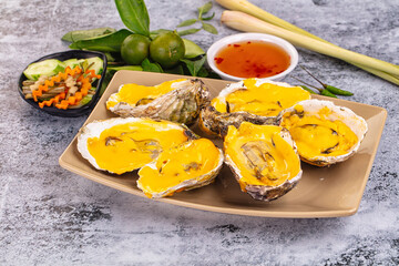 Baked oyster with cheddar cheese