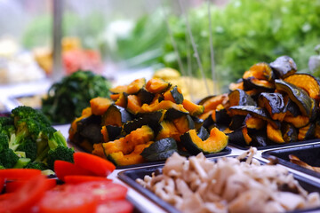 Grilled Japanese pumpkin, small pieces on a tray, buffet bar