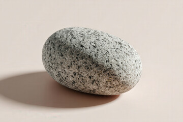 photorealistic ultraminimalist composition featuring single patterned stone resting on pure background