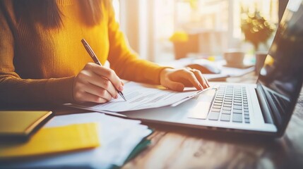 Close up, businesswoman hand with stylus pen signing e-document on digital tablet via mobile app with laptop computer on office table. Businesswoman working on tablet, internet networking