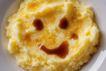 Mashed potatoes with whimsical gravy smile create playful expression