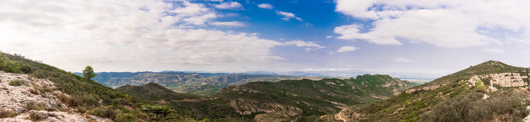 Fototapeta premium Wild landscape with mountains on a cloudy day, in Tavernes de La Valldigna, Comunidad valenciana (Spain