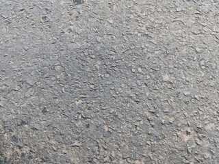 close up background texture of dark gray asphalt, top view
