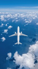 Airplane flying above clouds over the ocean captured from aerial perspective on clear sunny day