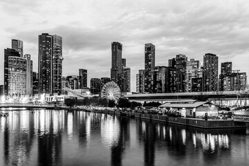 Melbourne, Victoria, Australia - 19 April 2025 : South Wharf Promenade at twilight on the banks of the river Yarra in black and white