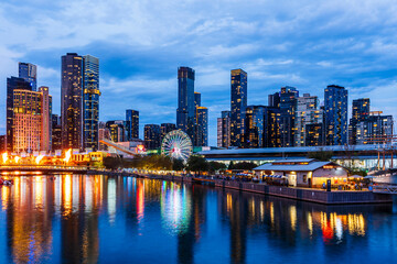 Melbourne, Victoria, Australia - 19 April 2025 : South Wharf Promenade at twilight on the banks of the river Yarra