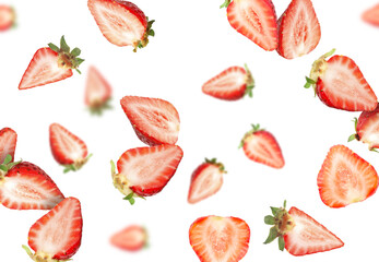 Cut fresh juicy strawberries falling on white background