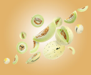 Tasty ripe melons swirling in air against beige gradient background
