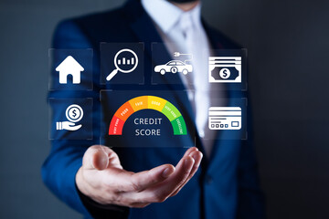 Credit score concept, businessman holding virtual screen of credit score icon for chart with credit...