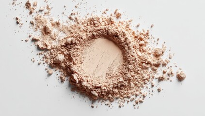 Light beige powder scattered around a hollow center