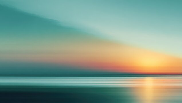 Blurry sunset over water. Soft, colorful, abstract, and tranquil. Long exposure creates motion blur of clouds and water. Muted, pastel colors dominate