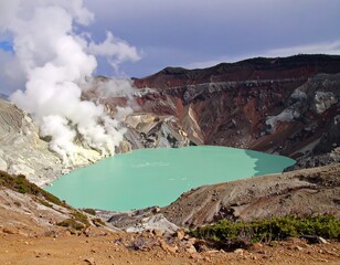 Volcanic crater lake with steam
