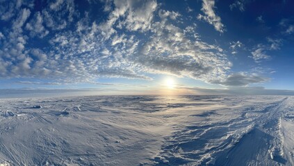 Naklejka premium Wide expanse of arctic snowscape under a vibrant sky