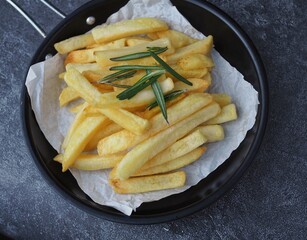 Close up,French fries with pan with rosemary 