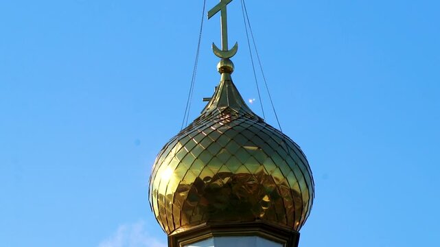 Green and white church cathedral with golden dome Mir Belarus.