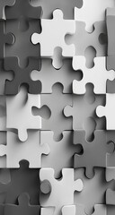 Close-up of many gray and white puzzle pieces