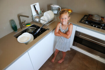 Dishwashing chore frustration for young girl