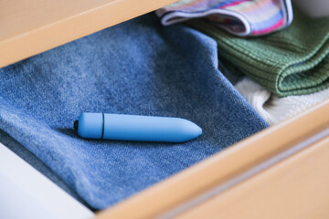 interiors of the beside table with underwear and a vibrator
