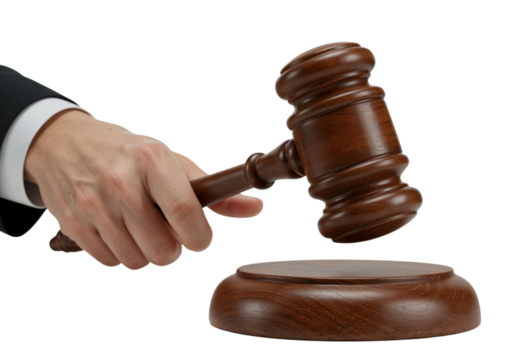 Hand holding a wooden gavel with base used for law, justice, and courtroom decisions.