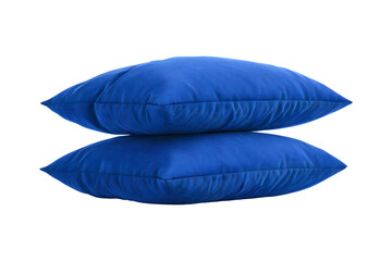 Comfortable dark blue pillows stacked against a transparent background adding to a relaxing feel