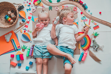 Kids draw and make crafts. Kindergarten or preschool background.