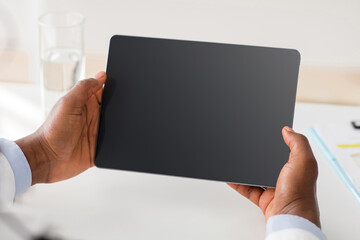Remote medical consultancy. African american doctor consulting patient via web conference on...