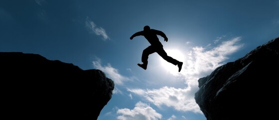 The daring jump of a silhouette against a bright sky.