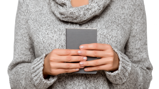 Close up perspective of a young woman's hands carefully holding a contemporary mobile device showcasing modern communication and technology in everyday life.