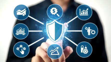 Finger presses digital shield with graph, money, and security icons in a business themed network over blurry suit - Powered by Adobe