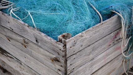fishing net stored in wooden box