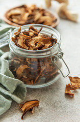 Dried mushrooms preserved in glass jar for culinary use