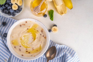 Sweet breakfast farina porridge with butter and fruits