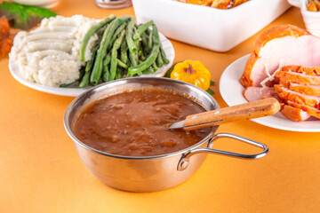 Homemade gravy sauce in small pot