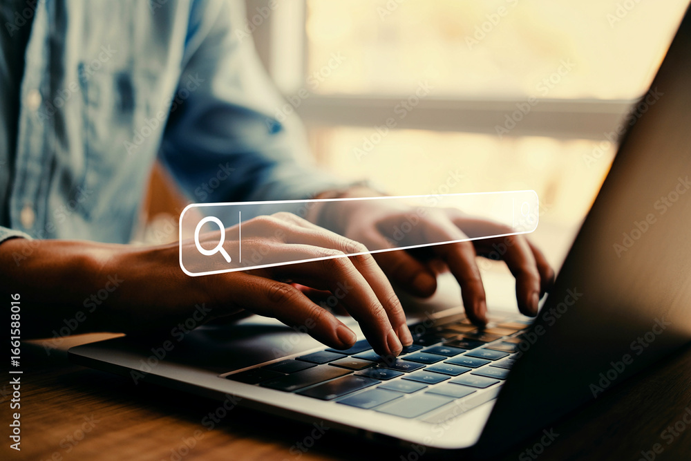 Poster hands typing on laptop keyboard searching online with magnifying glass overlay for website or resear