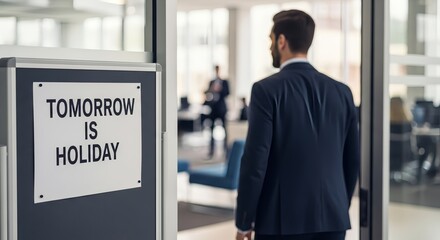 Fototapeta premium Businessman walking toward holiday sign in modern office, anticipating weekend break