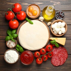 Pizza ingredients arranged on a wooden table