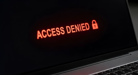 Laptop screen displaying access denied message, security breach warning
