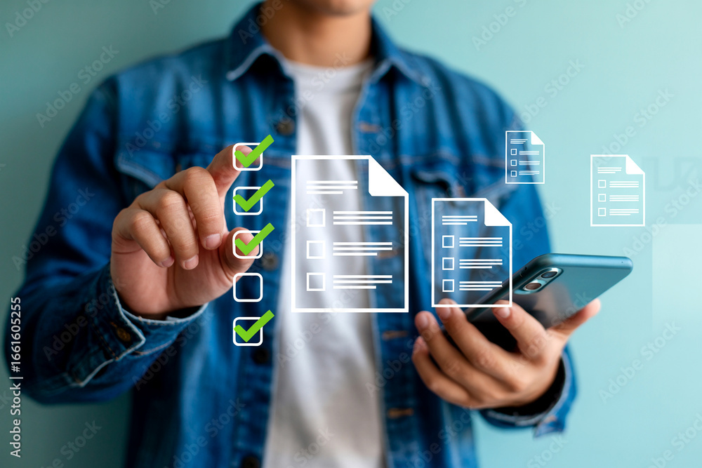 Aufkleber young man using his smartphone to access digital checklists complete tasks and manage productivity e
