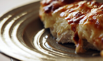 Baked chicken fillet with pineapple and cheese crust.