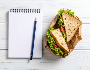 A vibrant sandwich sits beside a notepad, perfect for jotting down creative ideas.