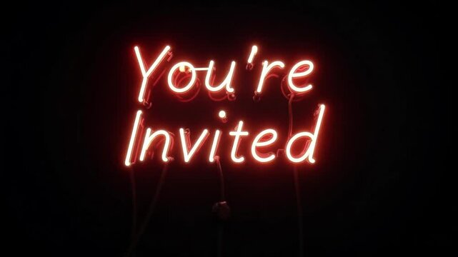 Illuminated you're invited neon sign with a warm red glow against a dark black background