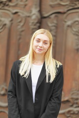 Fototapeta premium portrait, young girl, smiling, blonde portrait, long hair, beautiful, person, woman in black pajama, fashionable, resume portrait, young girl, 25, woman, beautiful lady